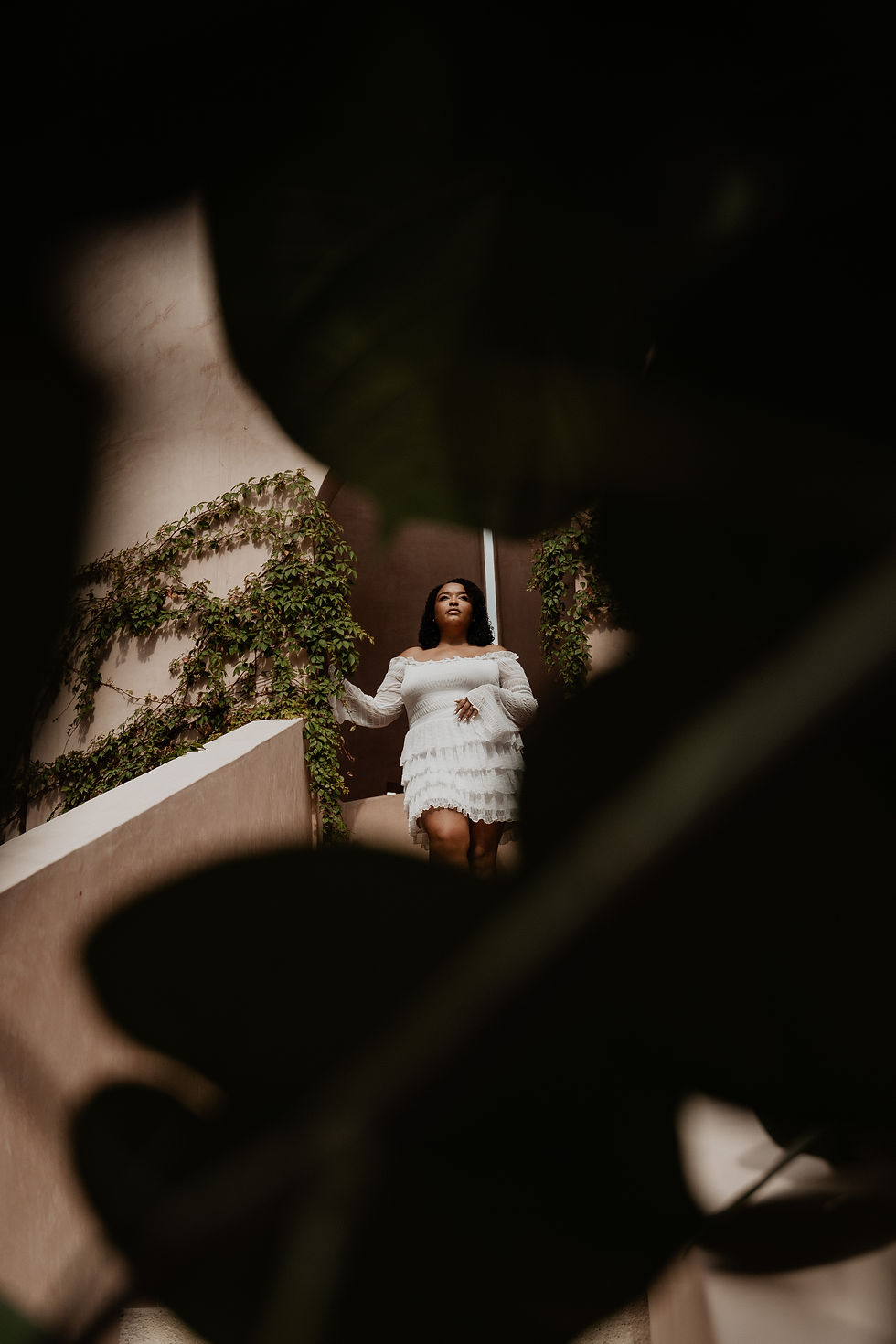 Bride posing editorially in a boho-styled venue, capturing the bridal look and vibe before her destination wedding.