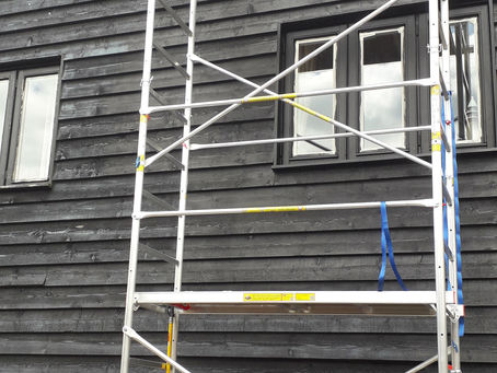 Using our own scaffold tower to reach the high gable end