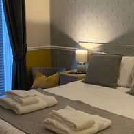 Standard double room at The Headlands Hotel with fresh décor and compact layout