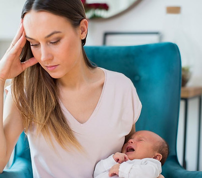 1_Stressed-Mother-Holding-Crying-Baby-Suffering-From-Post-Natal-Depression-At-Home.jpeg