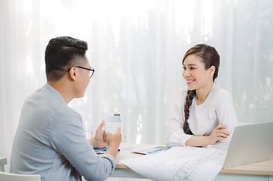 Real Estate Salesperson talking to a client