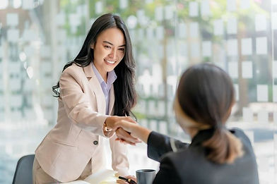 Asian businesswoman shaking hands to congratulate success