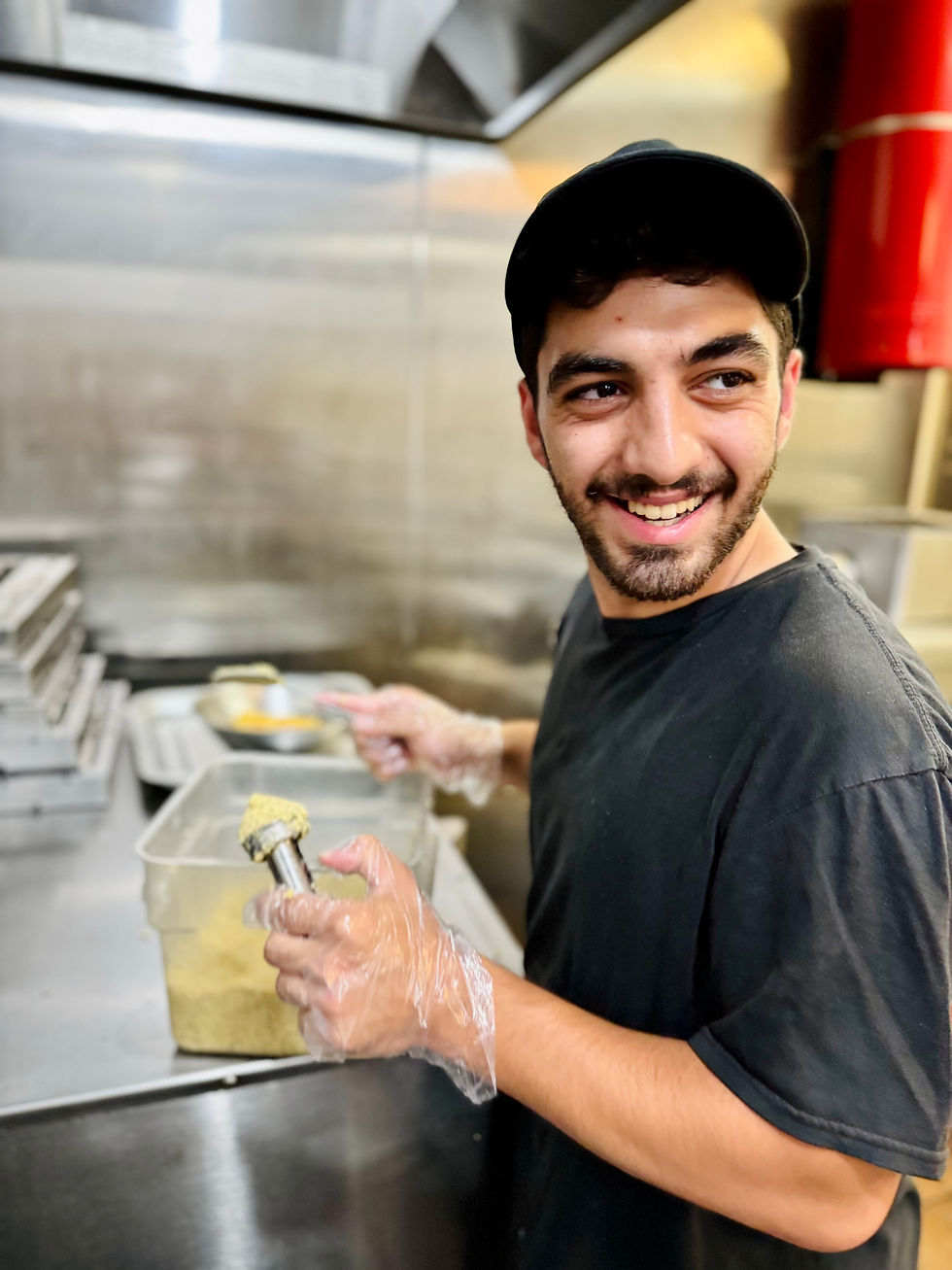 A Staff Member makes Falafel from scratch at Food Land Market in Boise.