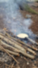 Pancakes cooking on the campfire