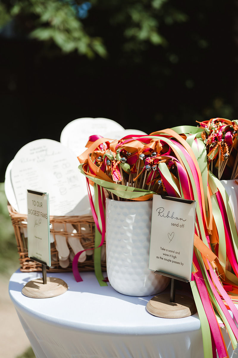 Neon streamers and glitter décor at Ivy Hall wedding