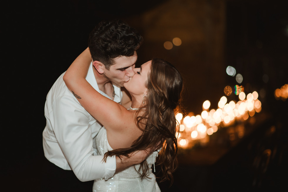 romantic kiss of bride and groom during final private dance