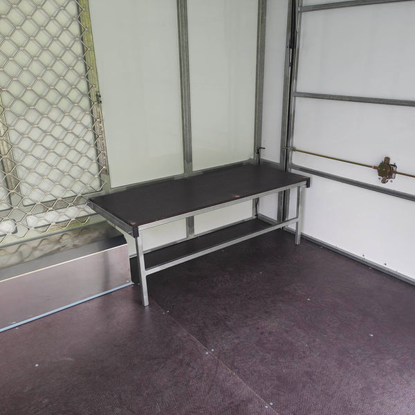 Sports trailer internal fitout with a fold-down bench seat