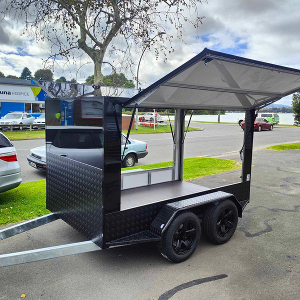 Small black trailer with three openings and powder coated treadplate upgrade