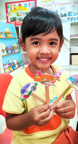 Childcare Student Showing Off Her Art