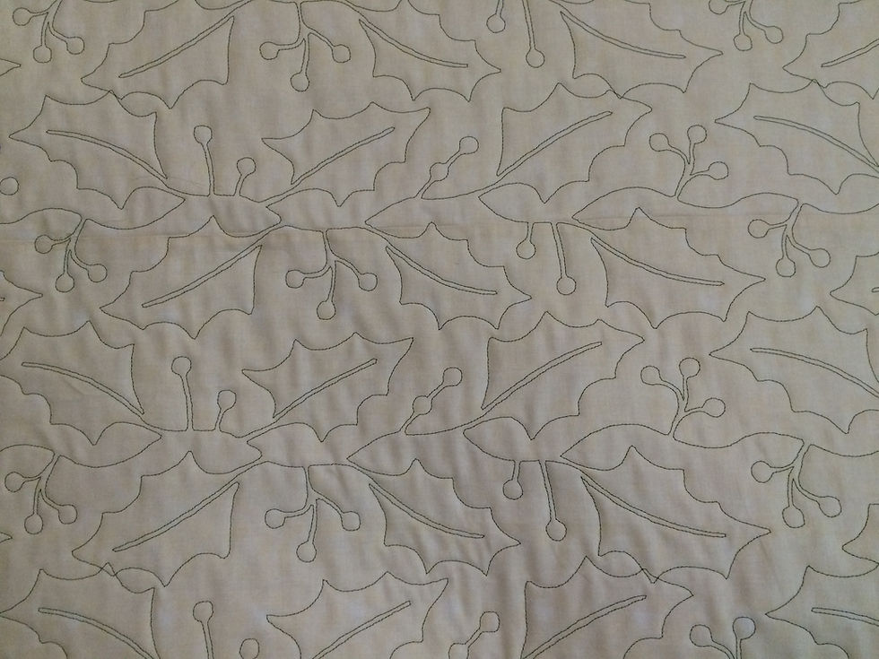 backing of Nancy Thornton's Christmas in soft reds and greens quilt