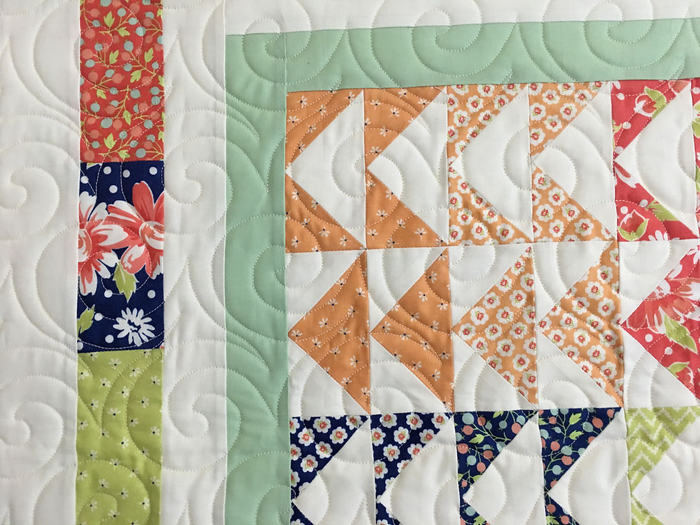 Swirls Quilting Pattern on Flying Geese Table Runner by Deb Taylor