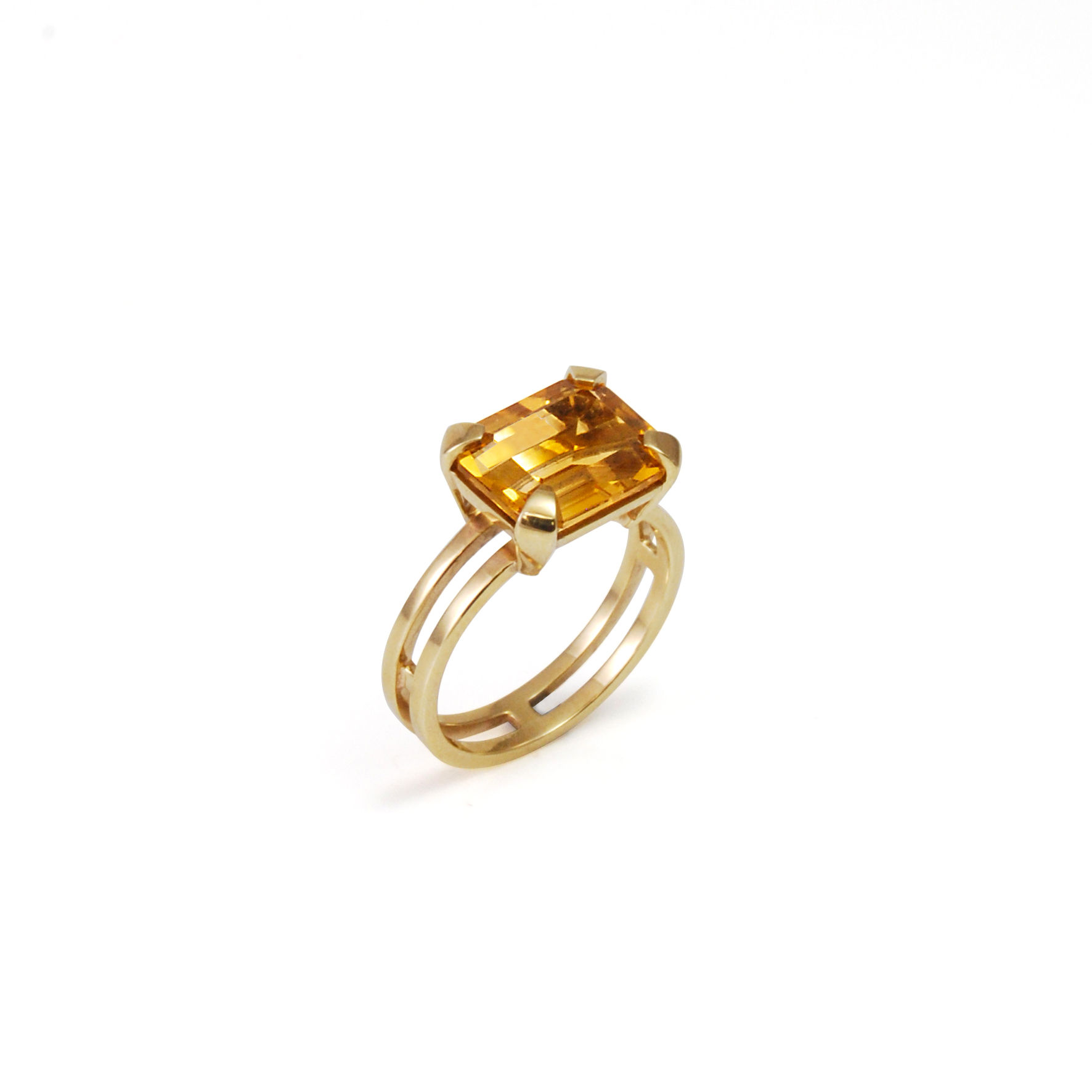 Parallel cocktail ring, with double line band in 9ct gold with Emerald cut Citrine prong set, angled shot on white background