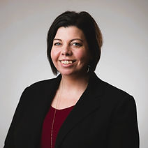 Angie Costley, founder of True North Accounting Solutions, smiling in professional attire, embodying expertise and trustworth