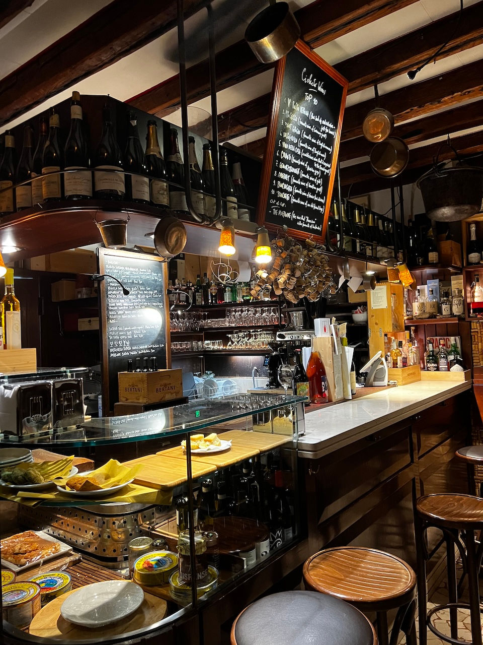 Sampling the local wine and cheese with a bite to eat at the romantic barcolo, Osteria al Cicheto; Bubbly Tourist's Best Things to See and Do and Where to Stay