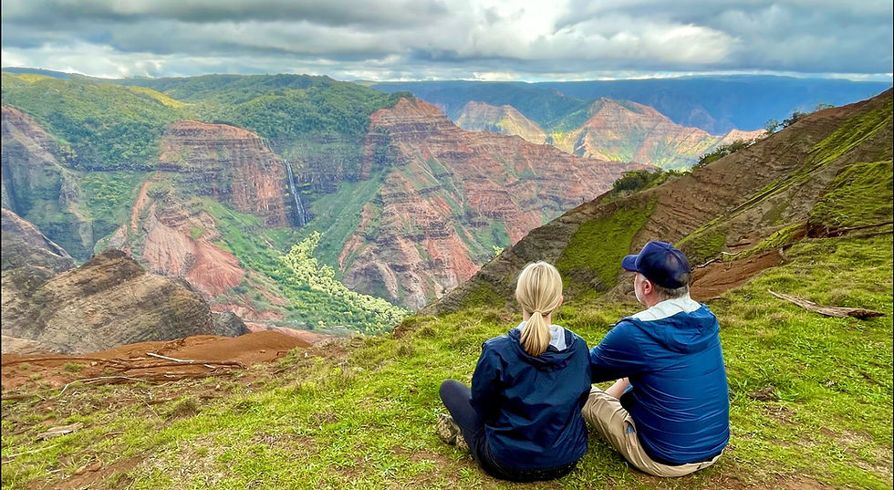 A lush green View of the Waipo'o Falls far in the distance in the Waimea Canyon State Park