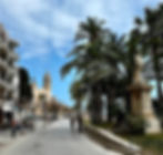 A stroll on the palm-lined promenade in Sitges leads to the17th-century Church of Sant Bartomeu & Santa Tecla; A Local's Guide to Exploring Barcelona: The Perfect Itinerary of the Top Things to See and Do by Area