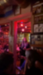 Listening to live Fado female singer at a small cramped bar in Lisbono