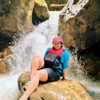 FTLO traveler canyoneering through waterfalls during an adventure activity on a Costa Rica group trip.