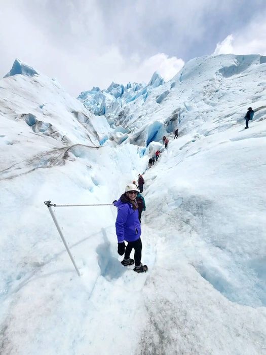 Solo traveler snowshoeing across Perito Moreno Glacier