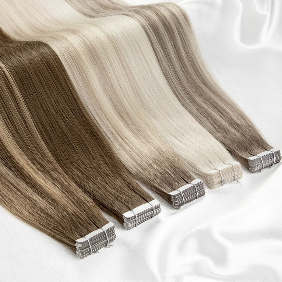 Thumbnail: Luxury private label tape hair extensions in various blonde shades