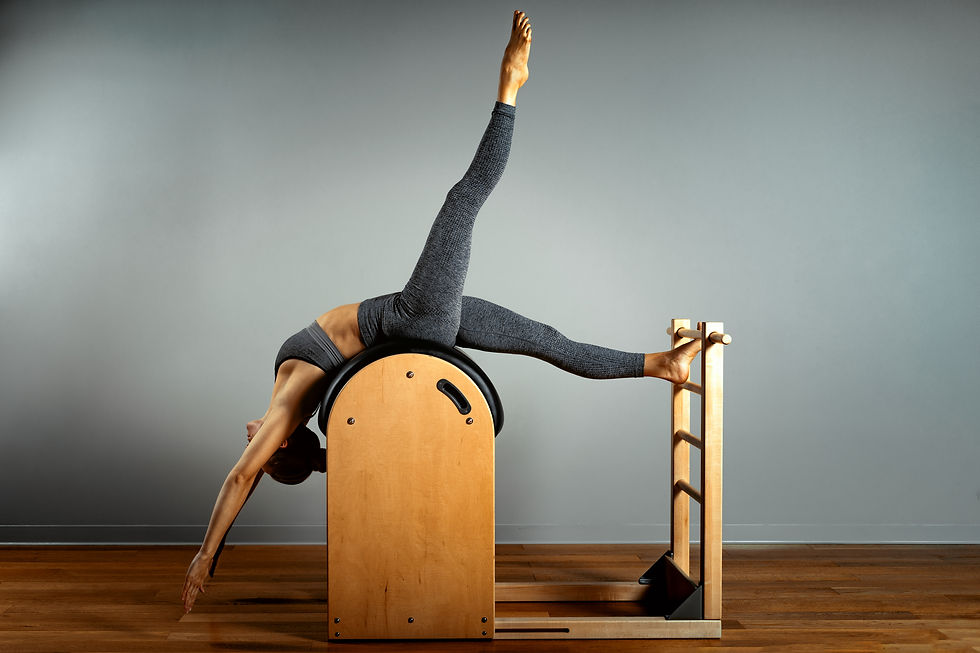 Person doing high barrel pilates workout
