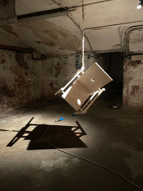 Antonio Scarponi, innocent chair suspended with a rope projecting shadows on the floor