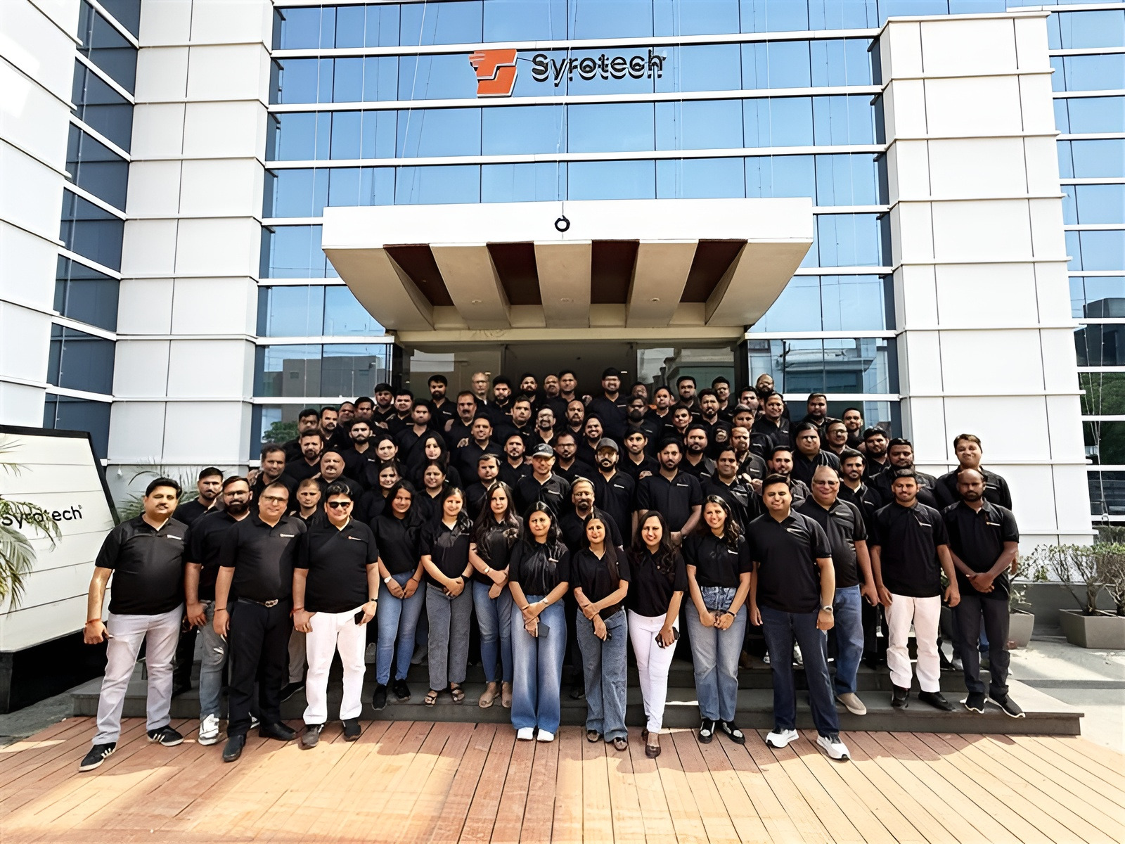 The Syrotech team outside the headquarters in Sector 63, Noida