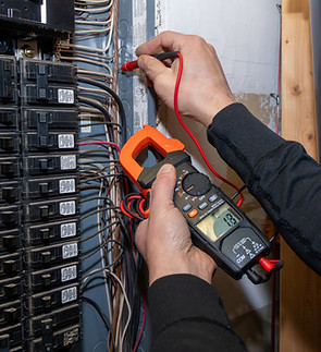 Home inspector testing home circuit breaker.jpg