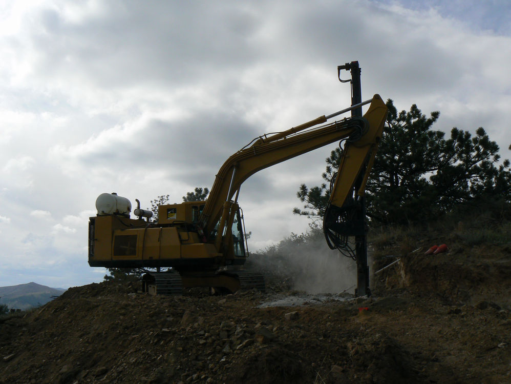 17.	The John Henry drilling holes for a home construction project on a rocky hillside.