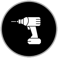 Icon of a white cordless drill on a gray background within a black circle, symbolizing construction or DIY activities.