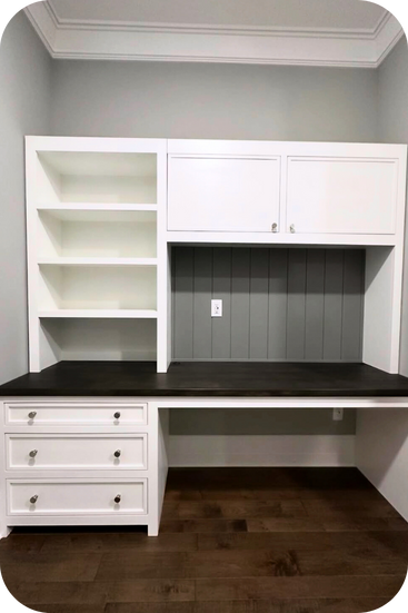A home office built by Knock on Wood. It features a two-tone design (white and wood) with a built-in desk completed with shelves and cabinets. 