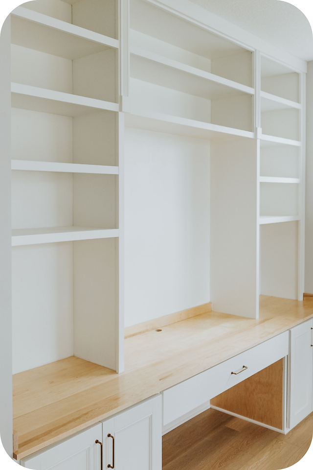 A Craft & Calling Co Custom Office Builtin. It's painted bright white and has a natural wood desk area. 