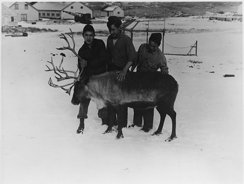 Three native boys on St. Paul Island, pictured with one of the St. Paul reindeer. Wiki Commons