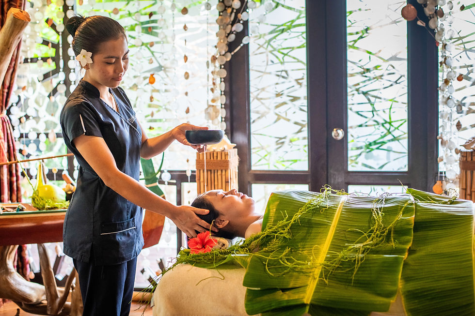 Maldivian Treatment Room at Sun Siyam Iru Fushi. Warm herbal oil is poured over the head after the body is wrapped in fresh banana leaves.