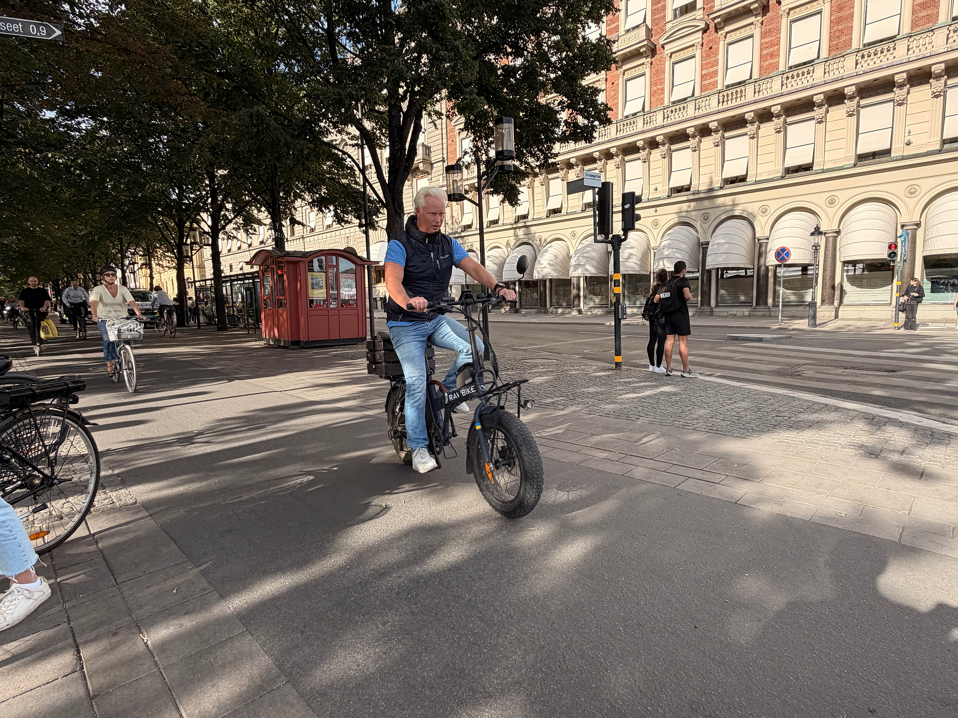 A man on an electric bike near Kungstradgarden, Stockholm
