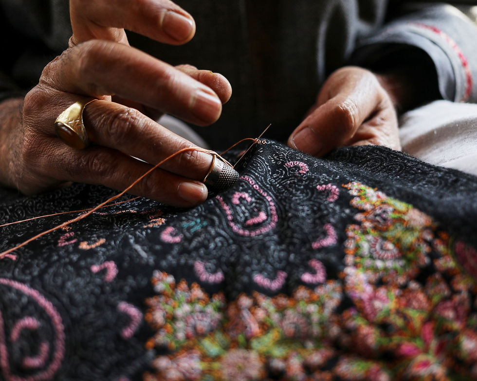 An artisan weaves a shawl in Kashmir
