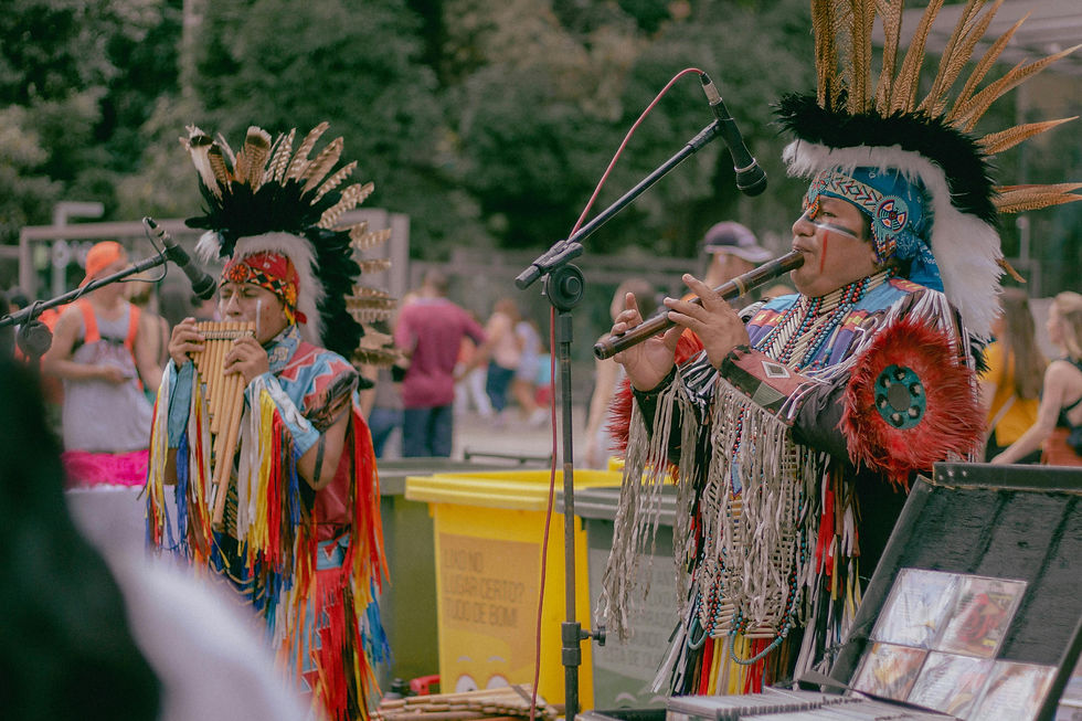 Photo of two Native Americans playing woodwind instruments. Photo by Gabriela Custódio da Silva on Pexels.