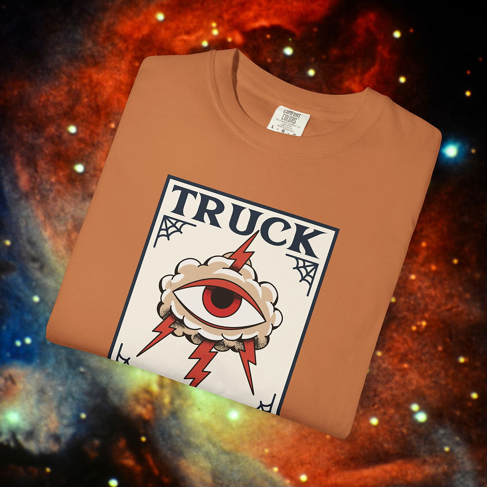 Thumbnail: Orange T-shirt with "TRUCK" graphic print, eye illustration, and a Liberal Tee.