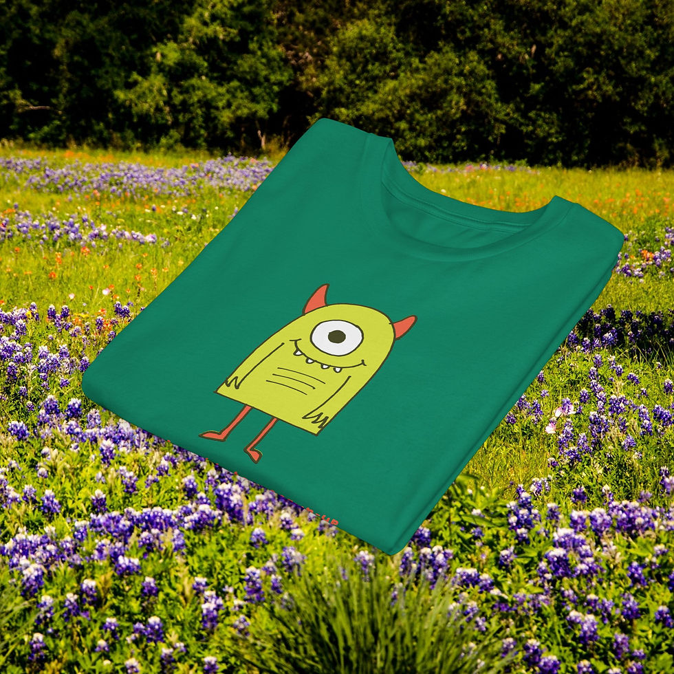 Thumbnail: Green t-shirt with a friendly monster design on a field of flowers.