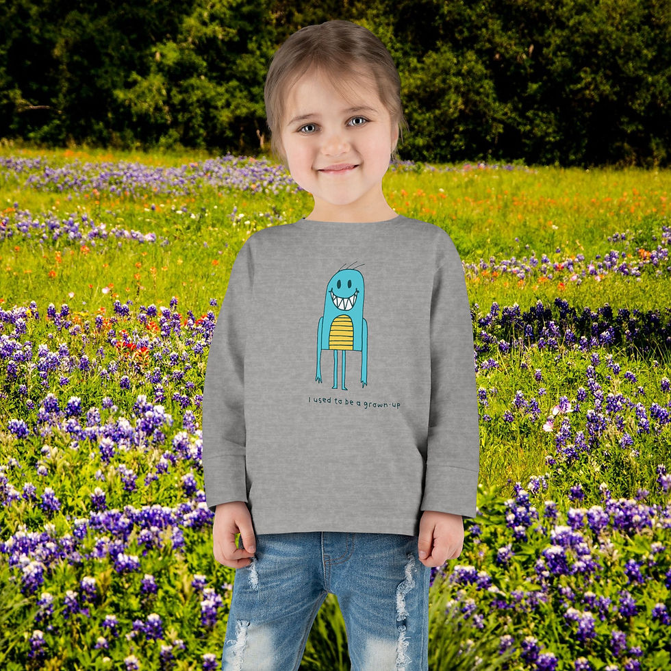 Thumbnail: Young girl wearing a gray shirt with monster, floral background and My Site 1