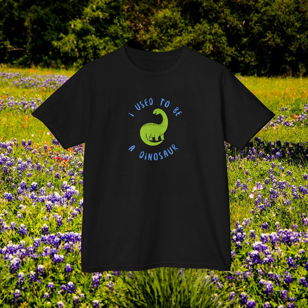 Thumbnail: Black shirt with text: I used to be a dinosaur, in field of flowers