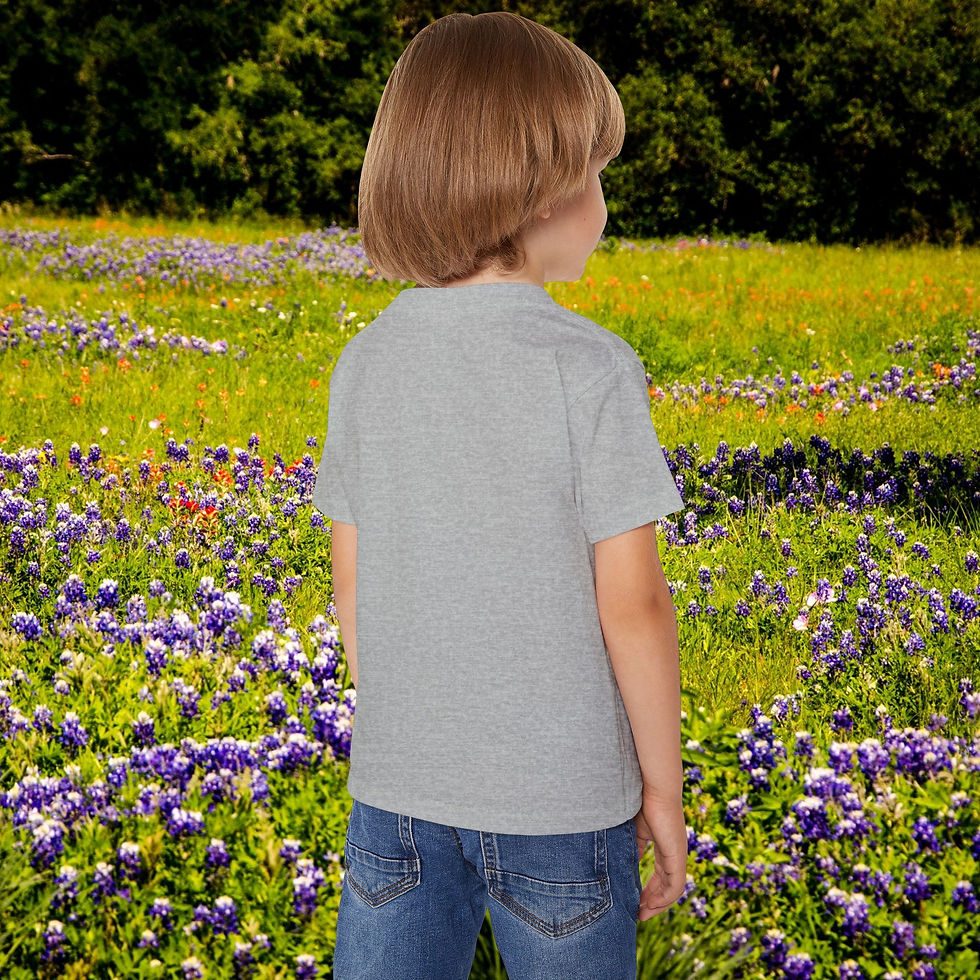 Thumbnail: Young child wearing grey t-shirt stands in a field of wildflowers My Site 1