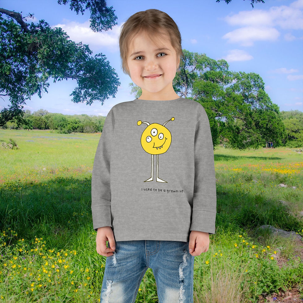 Thumbnail: Young girl wearing a gray shirt with a unique design and bright background