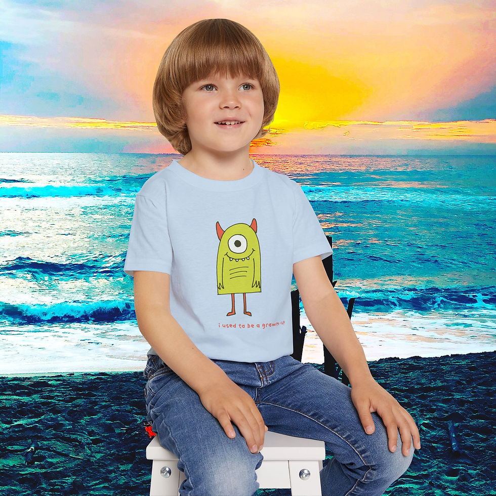 Thumbnail: Young boy wearing green monster shirt; ocean background; My Site 1.