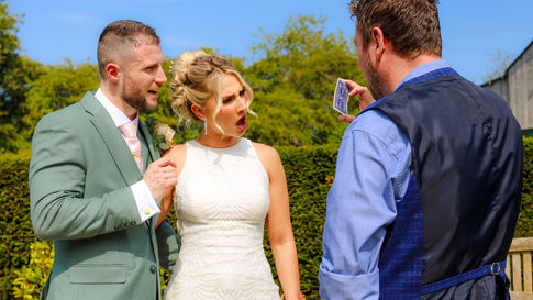 A Bride and Groom Look amazed by their ACMAGIC experience