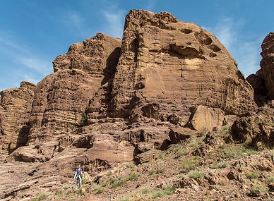 Hiking the Wadi Dana Trail with breathtaking valley views and wildlife.
