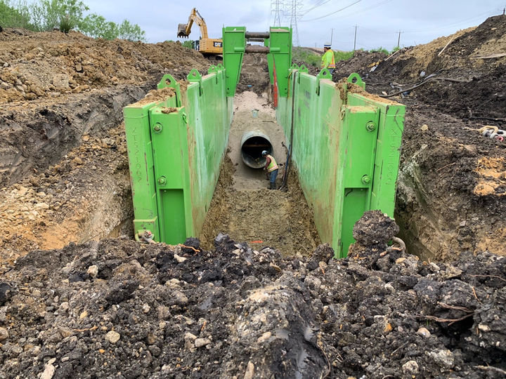 Large diameter pipe installation using open trench construction method.