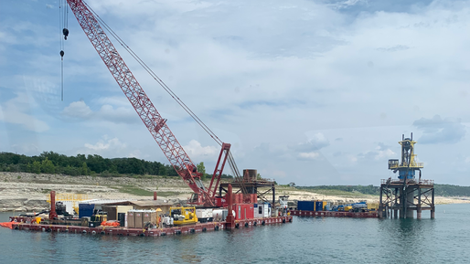 Barges supporting crane work activities along Lake Travis, Texas.