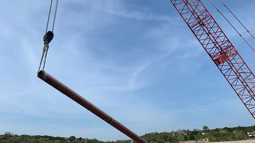 Barges supporting crane work activities along Lake Travis, Texas.