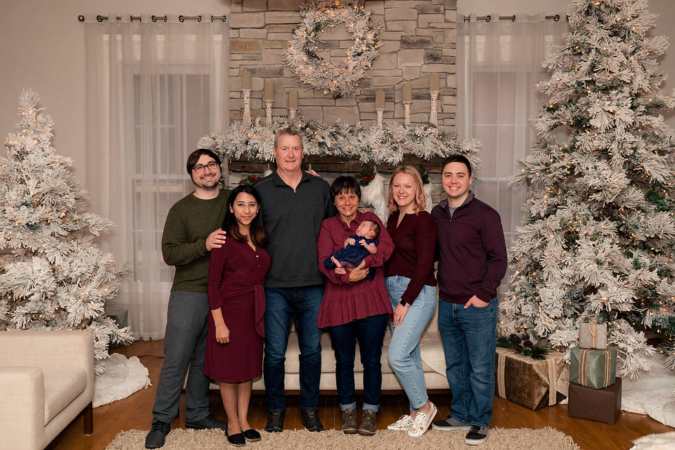 Extended family gathers in front of Christmas decor setup in the Ballroom at Studio821 in Newport, Kentucky.